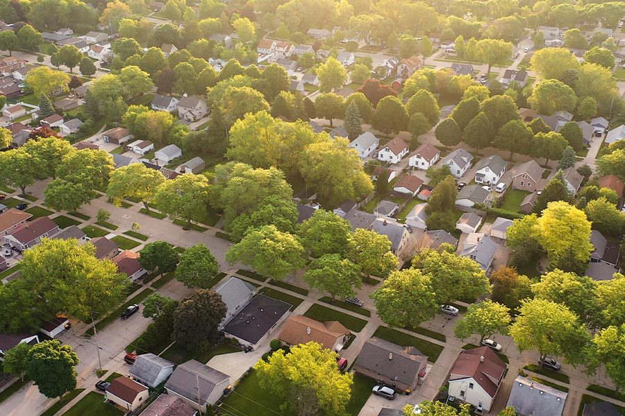 Marshfield, WI - Aerial View of Residential Houses in an American Suburb Neighborhood in the Summertime at Dusk